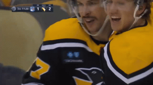 A Hockey Game Is Being Played Between The Penguins And The Rangers GIF