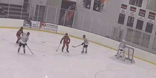 A Hockey Game Is Being Played In A Stadium With A Coca Cola Ad On The Walls GIF