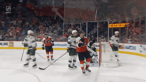 A Hockey Game Is Being Played In A Stadium With A Netmaster Ad In The Background GIF