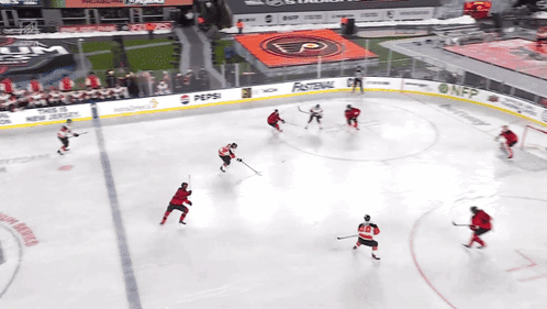A Hockey Game Is Being Played In A Stadium With A Pepsi Ad GIF