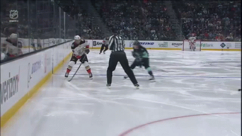 A Hockey Game Is Being Played In A Stadium With Advertisements For Amazon And Boeing GIF