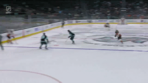 A Hockey Game Is Being Played In A Stadium With The Nhl Logo Visible GIF