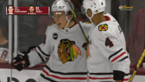 A Hockey Game Is Being Played In Chicago And The Players Are Kevin Korchinski And Seth Jones GIF