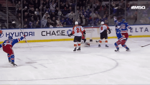 A Hockey Game Is Being Played In Front Of A Banner For Hyundai Chase GIF