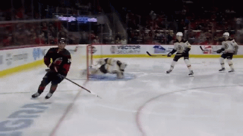 A Hockey Game Is Being Played In Front Of A Banner That Says " Vector Security " GIF