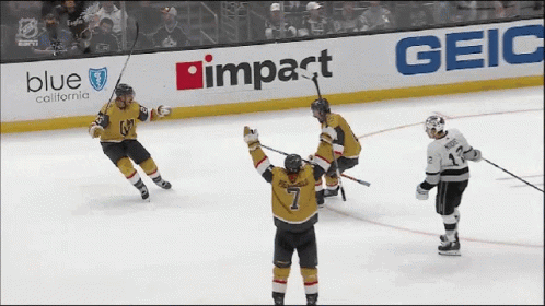 A Hockey Game Is Being Played In Front Of A Blue California Advertisement GIF