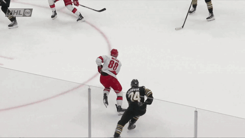 A Hockey Game Is Being Played In Front Of A Coca Cola Ad GIF