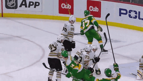 A Hockey Game Is Being Played In Front Of A Cub App Banner GIF