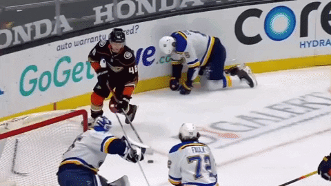 A Hockey Game Is Being Played In Front Of A Honda Advertisement GIF