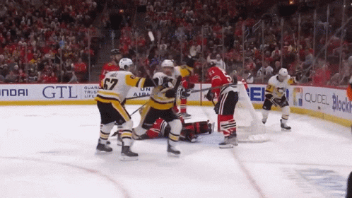 A Hockey Game Is Being Played In Front Of A Hyundai Sign GIF