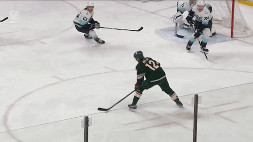 A Hockey Game Is Being Played In Front Of A Polaris Banner GIF