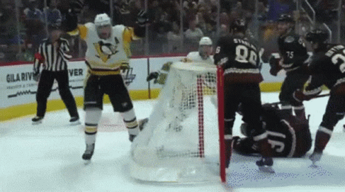 A Hockey Game Is Being Played In Front Of A Sign For Gila River GIF