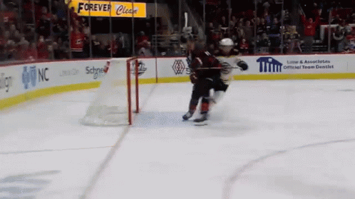 A Hockey Game Is Being Played In Front Of A Sign That Says Forever Cleats GIF