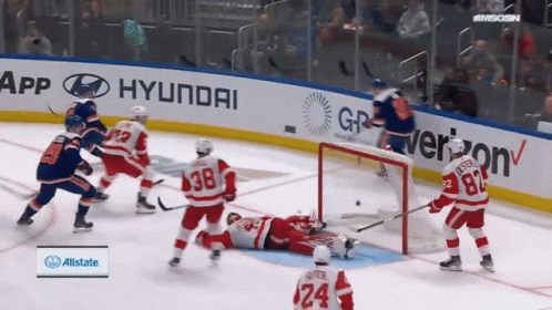 A Hockey Game Is Being Played In Front Of Hyundai And Verizon Advertisements GIF
