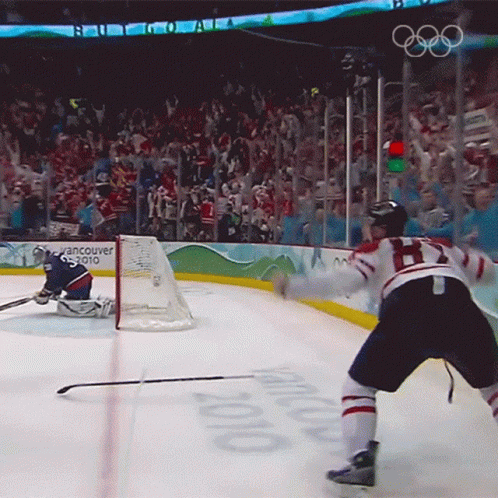 A Hockey Game Is Being Played In Vancouver In 2010 GIF