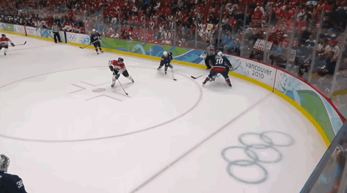 A Hockey Game Is Being Played In Vancouver In 2010 GIF