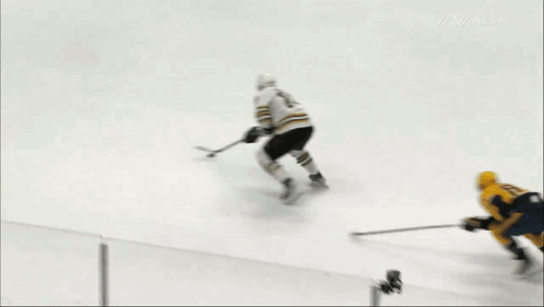 A Hockey Game Is Being Played On A Rink With A Bridgestone Advertisement In The Background GIF