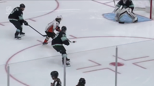 A Hockey Game Is Being Played On The Ice And The Goalie Is Wearing Bauer Gloves GIF