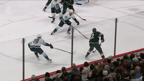 A Hockey Game Is Being Played With A Player Wearing Number 19 GIF