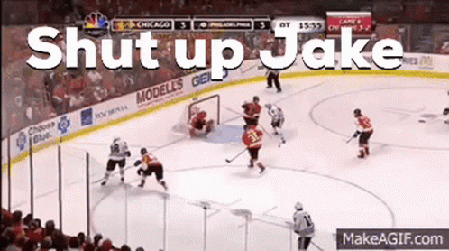 A Hockey Game Is Being Played With The Words Shut Up Jake Written On The Ice GIF