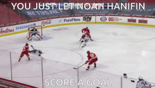 A Hockey Game Is Being Played With The Words " You Just Let Noah Hanifin Score A Goal " On The Bottom GIF
