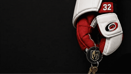 A Hockey Glove With The Number 32 On It Is Hanging On A Key Chain GIF