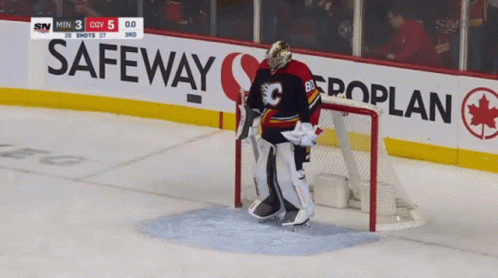 A Hockey Goalie Stands In Front Of A Safeway Banner GIF