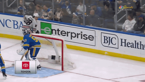 A Hockey Goalie Stands In Front Of A Toyota Sign GIF