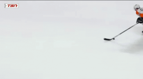 A Hockey Goalie With The Number 31 On His Jersey Makes A Save GIF