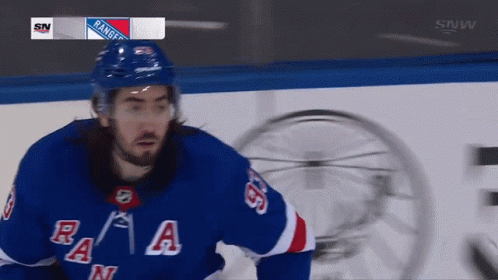 A Hockey Player For The New York Rangers Looks At The Camera GIF