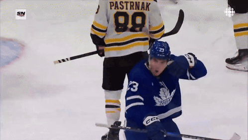 A Hockey Player Has The Number 99 On His Back GIF