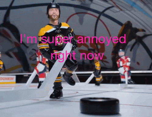 A Hockey Player Holding A Puck With The Words I 'M Super Annoyed Right Now GIF