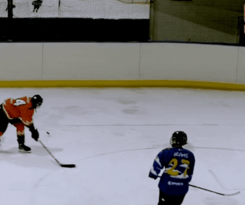 A Hockey Player In A Blue Jersey With The Number 21 On It GIF
