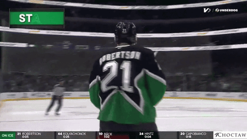 A Hockey Player In A Green And Black Jersey With The Number 21 On It GIF