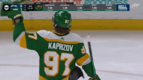 A Hockey Player In A Green Jersey With The Number 97 GIF