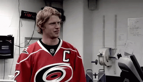 A Hockey Player In A Red Jersey With The Letter C On It GIF