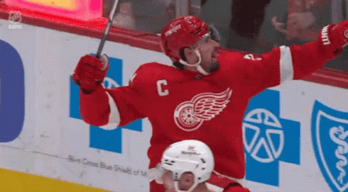 A Hockey Player In A Red Jersey With The Letter C On The Front GIF