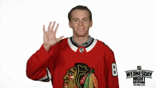 A Hockey Player In A Red Jersey With The Number 8 On It GIF