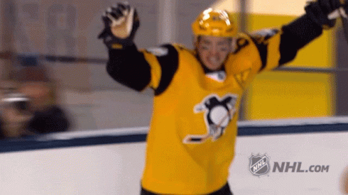A Hockey Player In A Yellow Jersey With The Nhl Logo GIF