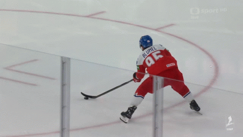 A Hockey Player In A Yellow Jersey With The Number 5 On It Is Laying On The Ice GIF