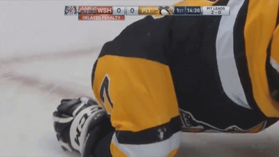 A Hockey Player Is Laying On The Ice With The Scoreboard Showing Pittsburgh Leading 2-0 GIF