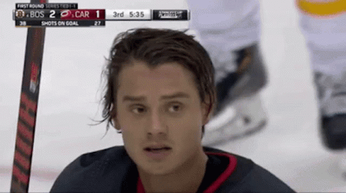 A Hockey Player Is Looking At The Scoreboard Which Says 3Rd At The Top GIF