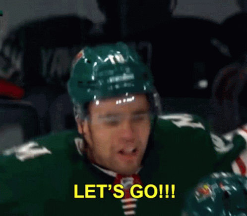 A Hockey Player Is Saying Let 'S Go While Another Player Looks On GIF