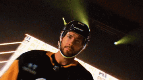A Hockey Player Is Wearing A Bauer Helmet GIF