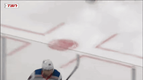 A Hockey Player Is Wearing A Rangers Jersey And Holding A Stick GIF