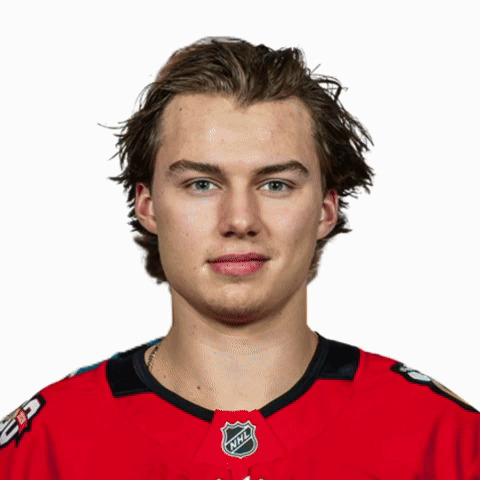 A Hockey Player Is Wearing A Red Jersey With The Nhl Logo On It GIF