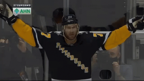 A Hockey Player Named Ruhwedel Is Hugging Another Player GIF