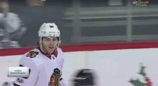 A Hockey Player On The Ice With A Nbc Sports Chicago Advertisement In The Corner GIF