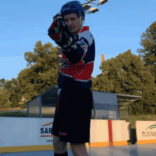 A Hockey Player Stands In Front Of A Wall That Says Sap On It GIF