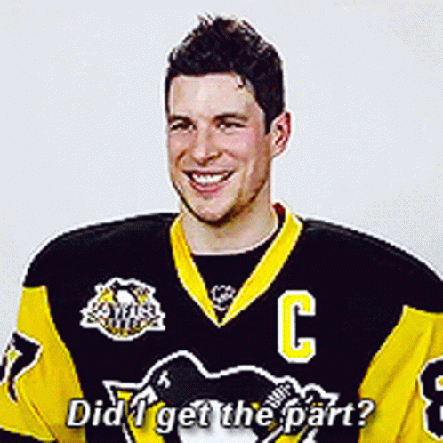 A Hockey Player Wearing A Black And Yellow Jersey With The Letter C On It GIF